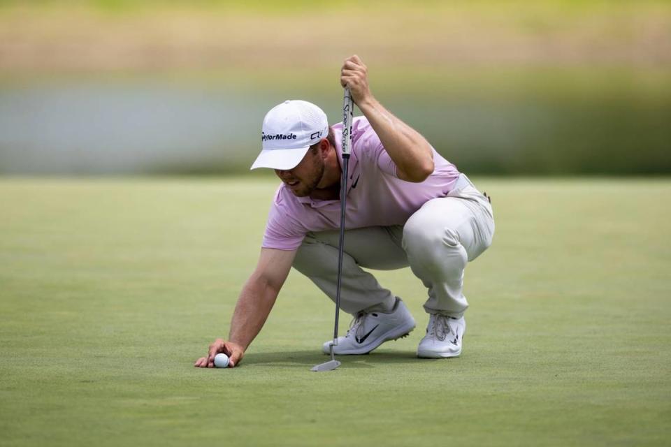 Pierceson Coody sets his ball up to putt during the first round of the 2024 ISCO Championship at Champions at Keene Trace Golf Club in Nicholasville, Ky, on Thursday, July 11, 2024. 