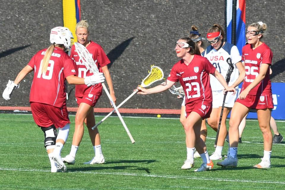 Gibbsboro native and England goalie Britt Read sprints across midfield to celebrate with Megan Whittle after a gaol against the United States at the 2022 World Lacrosse Women's Championship