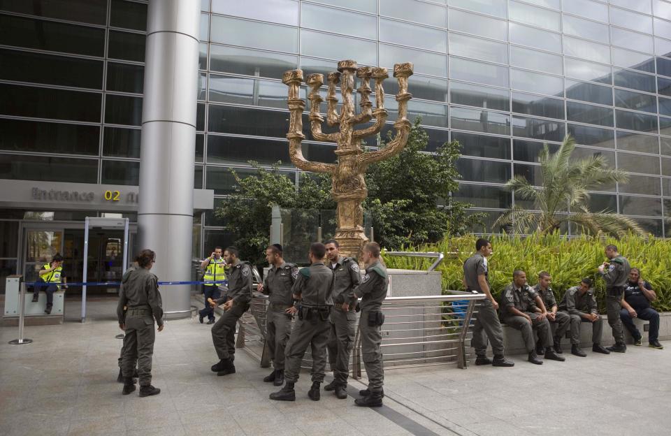 Israeli police officers are deployed at the Ben Gurion Airport near Tel Aviv, Israel, Sunday, April 15, 2012. Israel deployed hundreds of police Sunday at its main airport to detain activists flying in to protest the country's occupation of Palestinian areas, defying vigorous Israeli government efforts to block their arrival. (AP Photo/Dan Balilty)