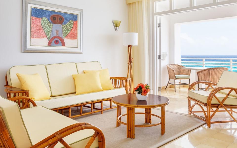 couples tower isle bedroom view of a living room with a couch and chairs