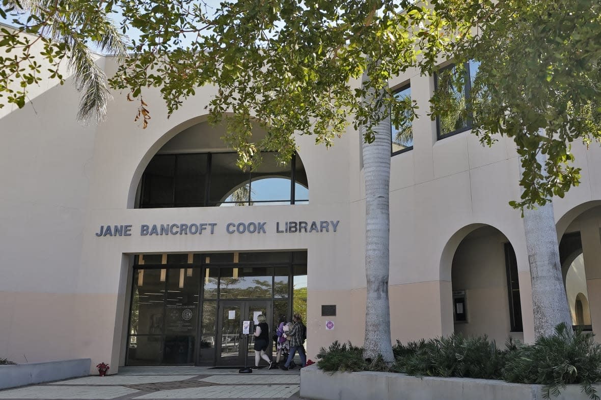 Students make their way into the Jane Bancroft Cook Library on the New College campus Friday, Jan. 20, 2023, in Sarasota, Fla. (AP Photo/Chris O’Meara)