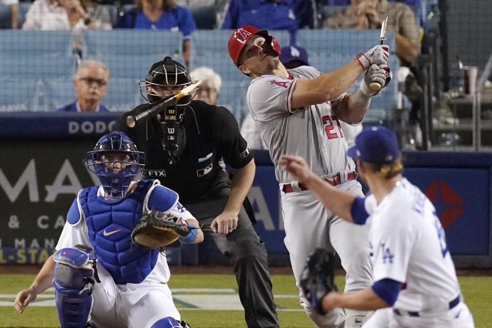 Plate umpire Nate Tomlinson is struck in the face with a broken bat after Mike Trout hits a single off Craig Kimbrel.