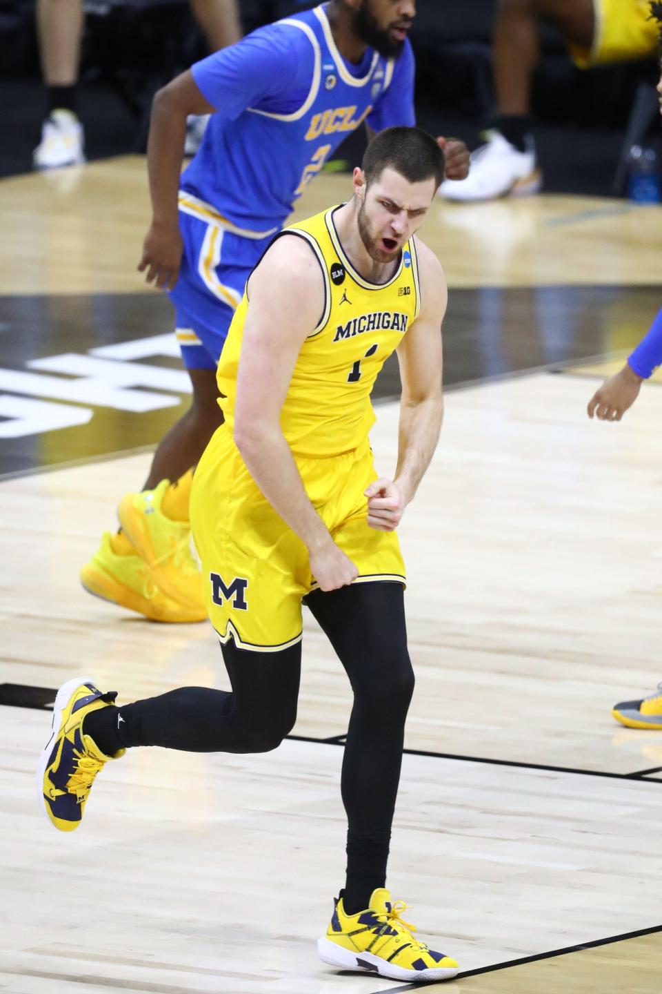 Michigan center Hunter Dickinson reacts during the first half of the Elite Eight game in the NCAA tournament on Tuesday, March 30, 2021, in Indianapolis.