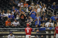 New York Mets fans react toward Philadelphia Phillies' Bryce Harper after Harper hit a home run during the sixth inning of the second baseball game of a doubleheader against the New York Mets Friday, June 25, 2021, in New York. (AP Photo/Frank Franklin II)