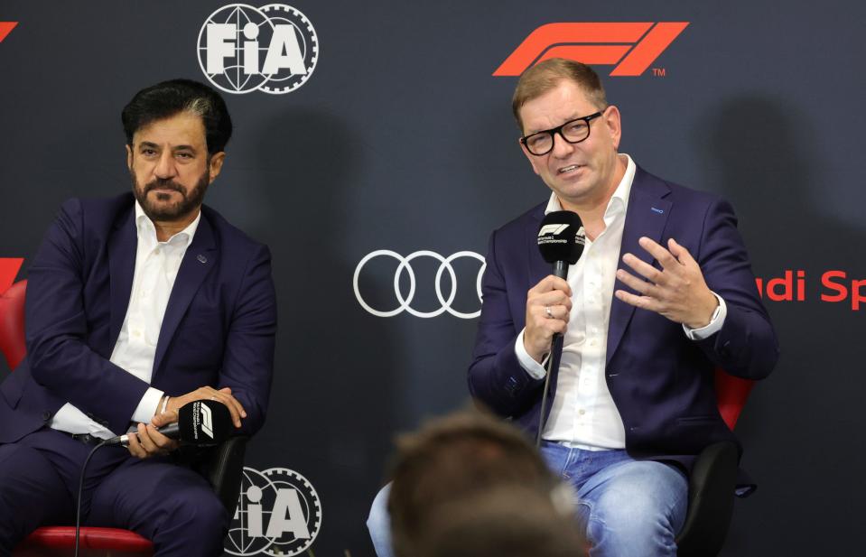 President of FIA Mohammed Ben Sulayem, left, and CEO of Audi Markus Duesmann address a media conference ahead of the Formula One Grand Prix at the Spa-Francorchamps racetrack in Spa, Belgium, Friday, Aug. 26, 2022. German manufacturer Audi will enter Formula One in 2026 in line with new engine regulations, chairman Markus Duesmann said on Friday. (AP Photo/Olivier Matthys)
