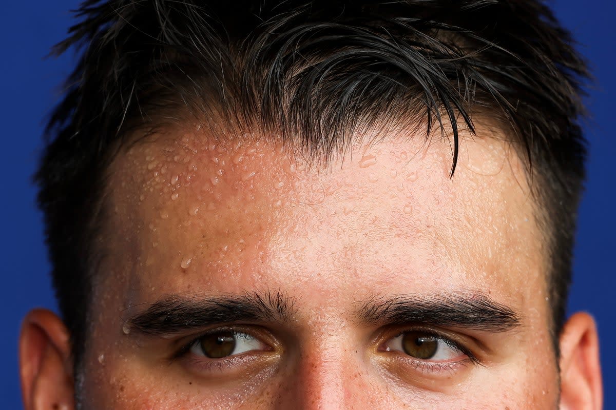 Sweat runs down the forehead of Jon Runyan #76 of the New York Giants, taken after an offseaon workout during New York’s heatwave  (Getty Images)