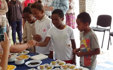 The first brave volunteers taste testing at a CRS event - Credit: Owen Fitzgerald/CRS