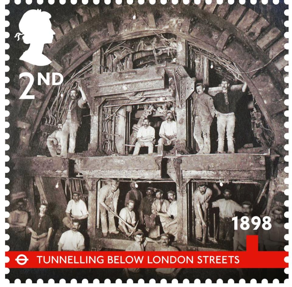 Railway construction workers excavate a tunnel in 1898 (Royal Mail)