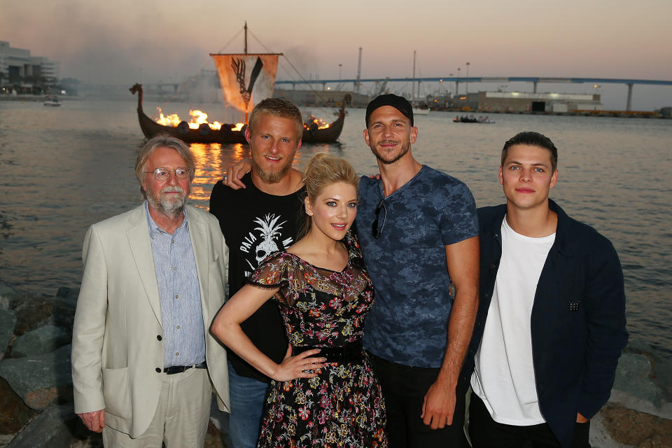 Michael Hirst and stars Alexander Ludwig, Winnick, Gustaf Skarsgård, and Alex Høgh Andersen attend the Viking Funeral Ceremony at San Diego Comic-Con 2017. (Photo: Joe Scarnici/Getty Images for History)