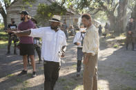 This image released by Apple TV+ shows director Antoine Fuqua, left, and actor Will Smith on the set of "Emancipation." (Quantrell Colbert/Apple TV+ via AP)