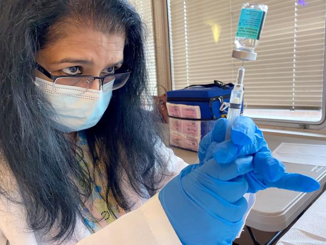 Supervising Public Health Nurse Beena John administers a shot with the polio vaccine at Rockland County's Yeager Health Center in Pomona July 25, 2022. 