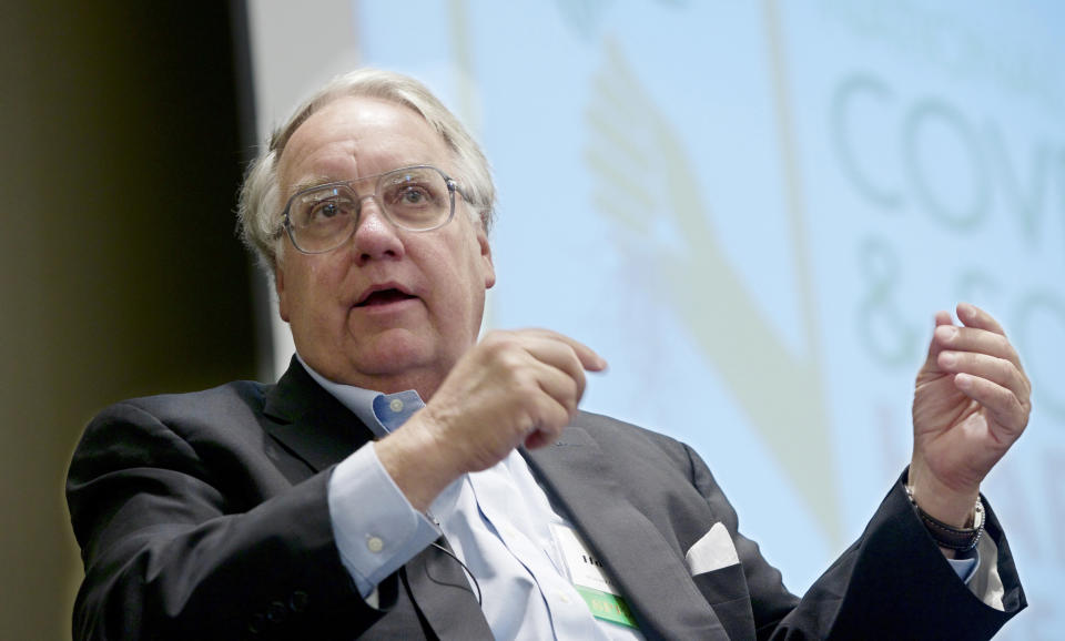 FILE - In this Tuesday, Feb. 18, 2014 file photo Philanthropist Howard G. Buffett, son of investor Warren Buffett, participates in a panel discussion at the conference on cover crops and soil health, in Omaha, Neb. Buffett has pledged nearly $24 million for protecting rhinos in South Africa, earmarking the money for ranger teams, sniffer dogs and other security measures in what he hopes can be a robust model for fighting what he calls the “overwhelming” problem of poaching in parts of Africa. (AP Photo/Nati Harnik, File)