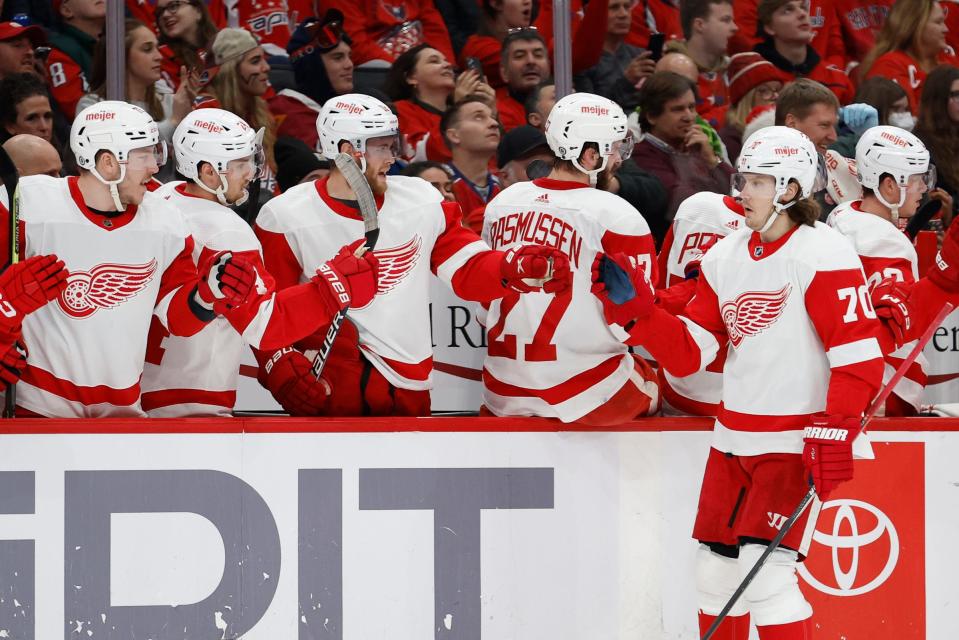 Red Wings center Oskar Sundqvist celebrates with teammates after scoring a goal against the Capitals in the first period on Monday, Dec. 19, 2022, in Washington.
