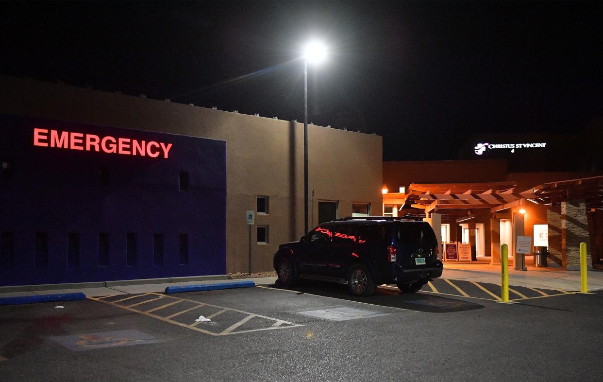 An exterior view shows a lighted 'EMERGENCY' sign near the emergency entrance to Christus St. Vincent Medical Center, where "Rust" director Joel Souza was transported, on October 21, 2021 in Santa Fe, New Mexico.