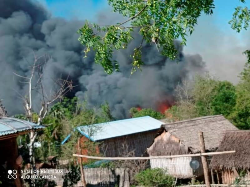 A view shows smoke from the fire in Kin Ma Village