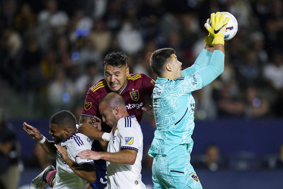LA Galaxy goalkeeper Jonathan Bond, right, makes a save during the second half of an MLS soccer match against the Real Salt Lake in Carson, Calif., Saturday, Oct. 1, 2022. (AP Photo/Ashley Landis)
