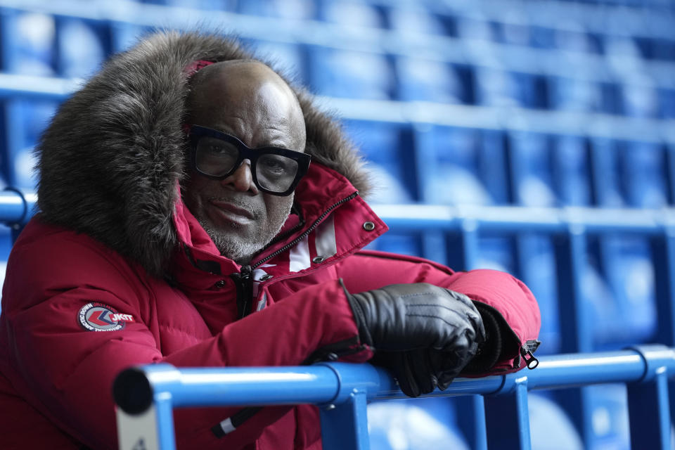 Former Chelsea soccer player Paul Canoville poses for a portrait during an interview with the Associated Press at Chelsea's Stamford Bridge ground in London, Thursday, March 2, 2023. Black players were only just beginning to integrate into some of England's biggest soccer teams in the 1980s when racism was rife and hooliganism was on the rise. British-born Paul Canoville tells The Associated Press how he was regularly called "the N-word," told to "go home" and had bananas thrown at him when he played for Chelsea. Even more astounding to him was the source of the vitriol. Canoville says "it was the majority of my own fans." (AP Photo/Alastair Grant)