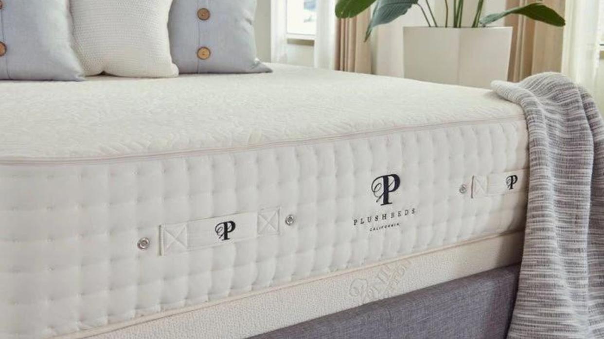  A mattress from one of the best places to buy a mattress, PlushBeds, topped with pillows. 
