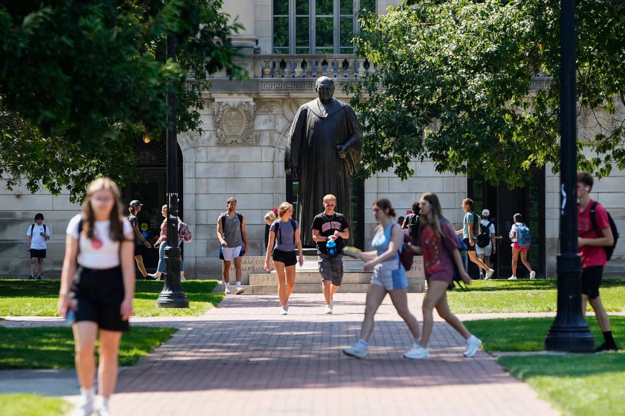 Ohio State students walk across the Oval on Aug. 24, 2023 at the university's main campus in Columbus.