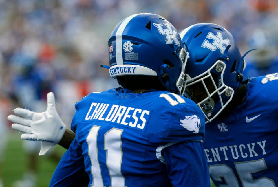 Kentucky’s Zion Childress intercepted the ball and celebrated with Jordan Lovett against Ball State at Kroger Field.
Sept. 2, 2023
