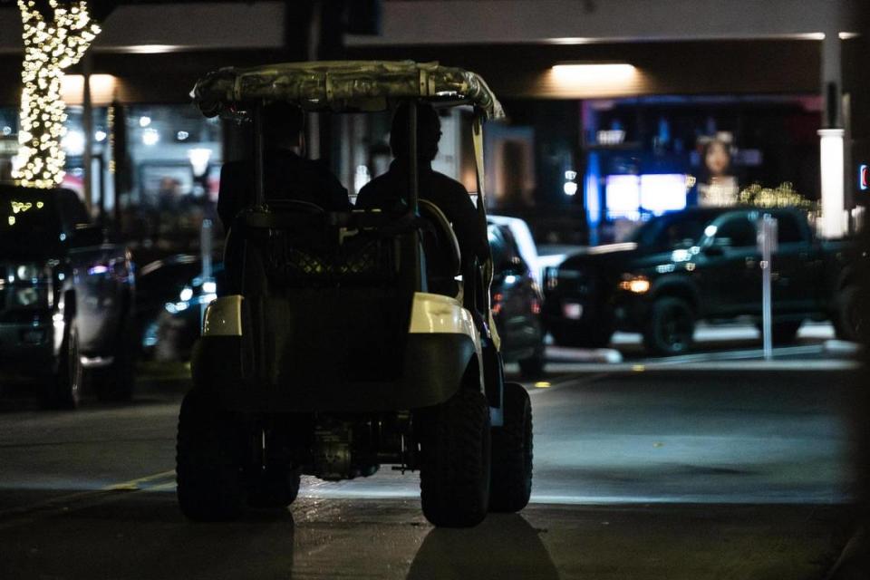 Security guards patrol the streets on golf carts on West 7th Street in Fort Worth on Friday, March 22, 2024. Out of a total of 3,197 crimes reported in Fort Worth’s entertainment districts from Jan. 1, 2023, to March 10, 2024, the largest number happened in the West 7th area, totaling 1,288. Chris Torres/ctorres@star-telegram.com