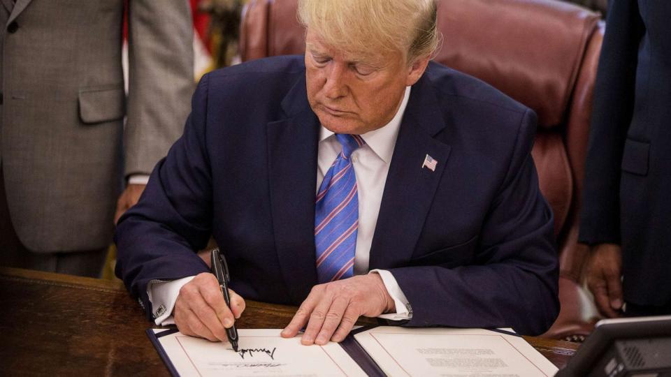 PHOTO: FILE - U.S. President Donald Trump signs H.R. 3151, the Taxpayer First Act, during a ceremony in the Oval Office of the White House in Washington, D.C., July 1, 2019. (Bloomberg via Getty Images, FILE)