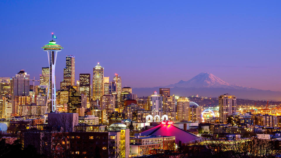 A scenic view of the Space Needle in Seattle, WA and the Mt. Rainier
