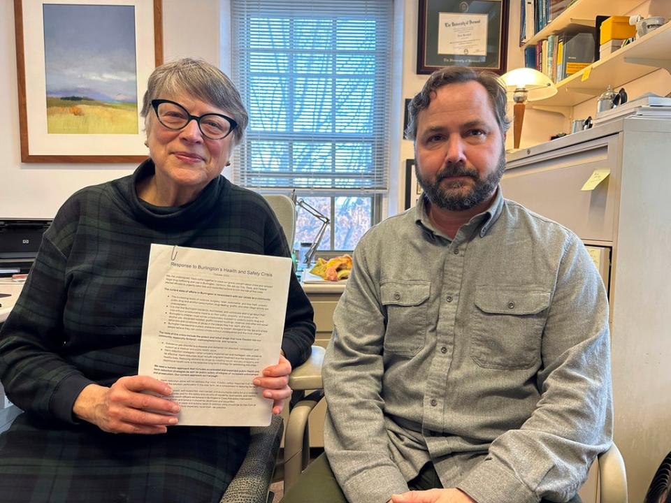 Jane Knodell, a former president of the Burlington City Council, holds a letter on Dec. 6, 2023, in Burlington, Vt., that she and fellow resident Andrew Vota, right, drafted and circulated. About 1,500 people have signed the letter raising concerns about public drug and alcohol use and violence in the city and what can be done to address the problems.