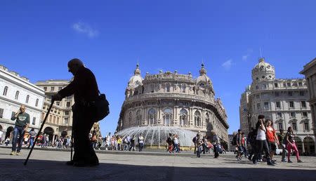 A man walks in De Ferrari square in Genoa in this May 14, 2013 file photo. REUTERS/Alessandro Garofalo/Files