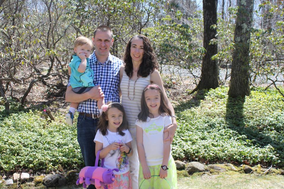 Kyle Seitz, holding son Benjamin, and Lindsey Rogers-Seitz with their daughters in 2014.