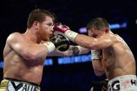 Sep 15, 2018; Las Vegas, NV, USA; Canelo Alvarez (black trunks) and Gennady Golovkin (white trunks) box in the middleweight world championship boxing match at T-Mobile Arena. Alvarez won via majority decision. Mandatory Credit: Joe Camporeale-USA TODAY Sports