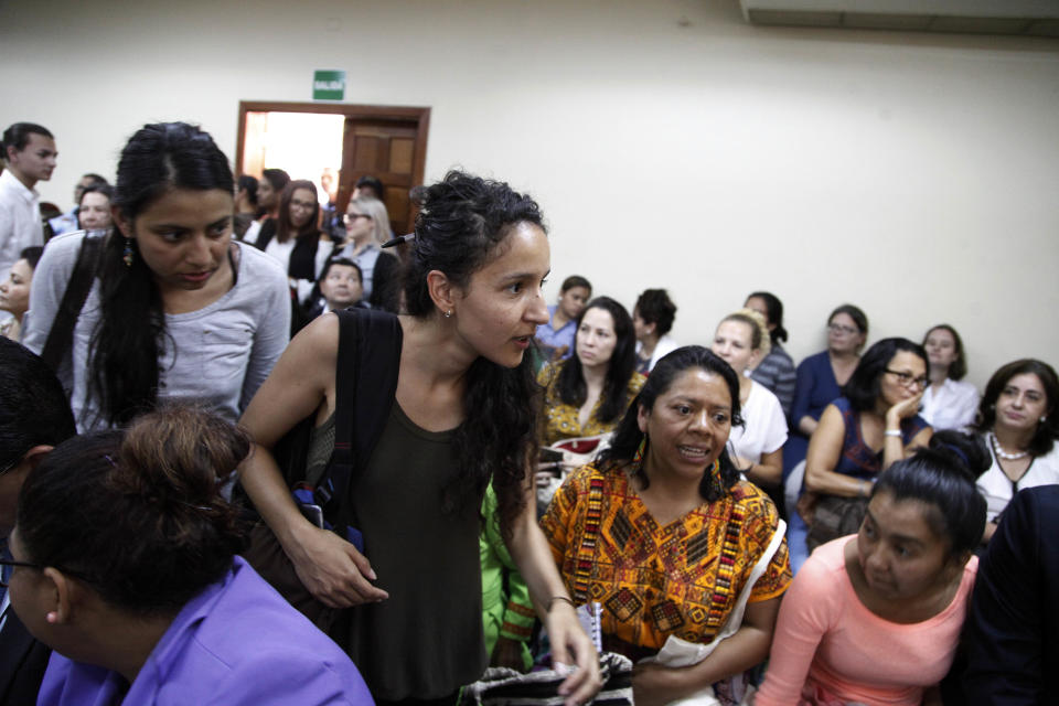 Bertha Zuniga Caceres, center, daughter of the murdered Honduran environmentalist Berta Caceres, arrives in court for the trail of her mother’s muder, in Tegucigalpa, Honduras, Monday, Sept. 17, 2018. Honduras' supreme court has indefinitely suspended the start of the trial of eight men accused in the 2016 killing of Caceres, citing five related filings pending at the criminal appeals court that have to be resolved. (AP Photo/Fernando Antonio)