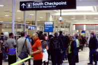 A line of passengers approaches a Transportation Security Administration (TSA) PreCheck security checkpoint at Hartsfield-Jackson Atlanta International Airport amid the partial federal government shutdown, in Atlanta, Georgia, U.S., January 18, 2019. REUTERS/Elijah Nouvelage