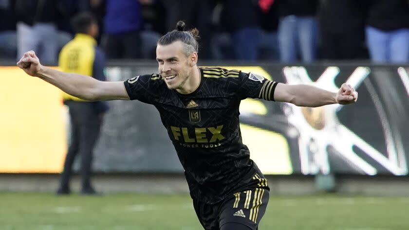 FILE - Los Angeles FC forward Gareth Bale (11) celebrates after defeating the Philadelphia Union in penalties to win the MLS Cup soccer match Saturday, Nov. 5, 2022, in Los Angeles. Bale has announced on Monday, Jan. 9, 2023, his retirement from soccer at age 33. He scored 53 Premier Leagues goals and 81 in La Liga, finishing last season by helping Los Angeles win the Major League Soccer title. Bale won five Champions League titles, three Spanish league titles, one Copa del Rey and one League Cup. (AP Photo/Marcio Jose Sanchez, File)