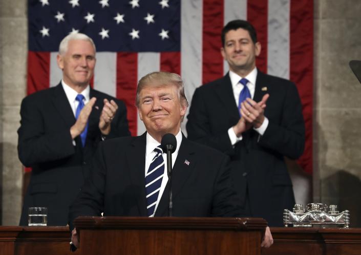 President Donald Trump, flanked by Vice President Mike Pence and House Speaker Paul Ryan of Wis., arrives on Capitol Hill in Washington, Tuesday, Feb. 28, 2017, for his address to a joint session of Congress. (Jim Lo Scalzo/Pool Image via AP)