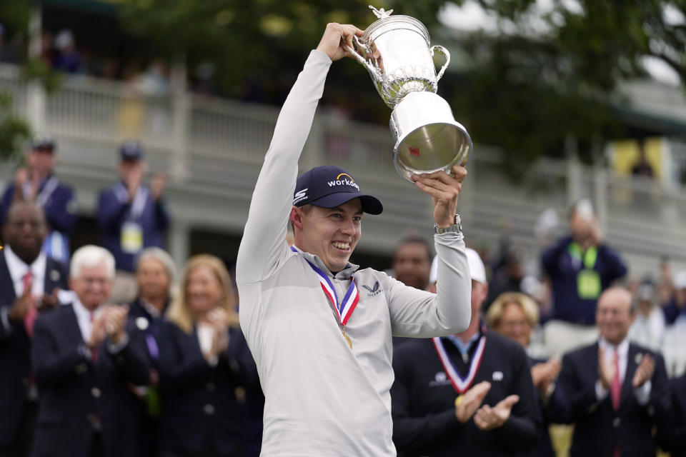 Matthew Fitzpatrick, of England, celebrates with the trophy after winning the U.S. Open golf tournament at The Country Club, Sunday, June 19, 2022, in Brookline, Mass. (AP Photo/Charles Krupa)