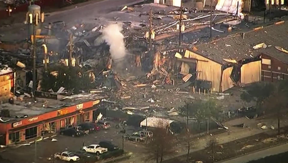 This aerial photo taken from video provided by KTRK-TV shows damage to buildings after an explosion in Houston on Friday, Jan. 24, 2020. A large explosion left rubble scattered in the area, damaged nearby homes and was felt for miles away. A fire continues to burn and people have been told to avoid the area. (KTRK-TV via AP)