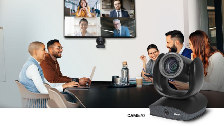  People sit on a videoconference call in a meeting room using AVer PTZ cameras. . 
