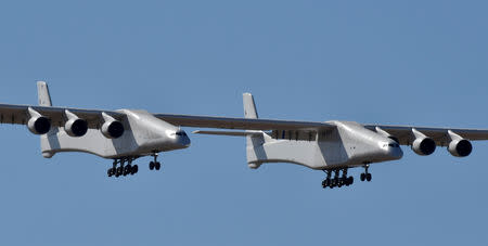 The world's largest airplane, built by the late Paul Allen's company Stratolaunch Systems, makes its first test flight in Mojave, California, U.S. April 13, 2019. REUTERS/Gene Blevins