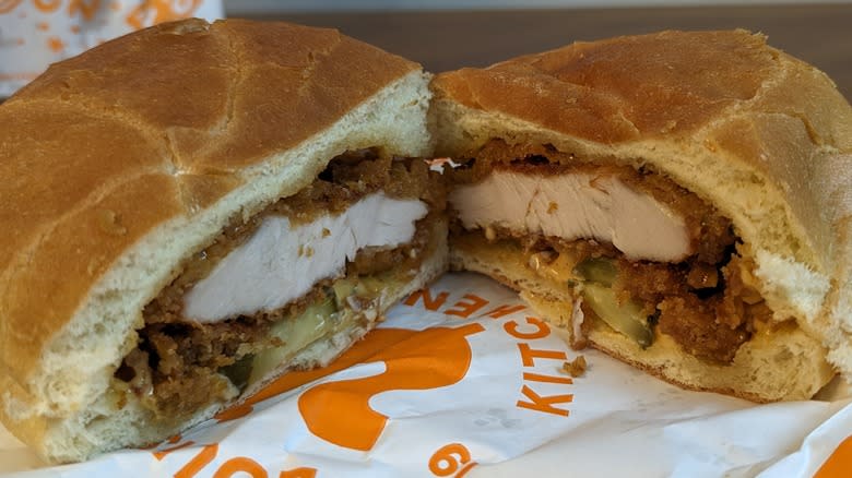 halved Popeye's chicken sandwich