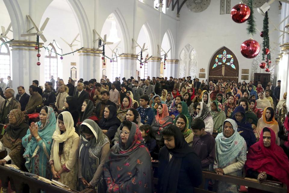 Pakistani Christian women attend the Christmas Mass at a church in Peshawar, Pakistan. <a href="https://newsroom.ap.org/detail/PakistanChristmas/331743ae23494157992442e1f9625446/photo?Query=church%20pakistan&mediaType=photo&sortBy=&dateRange=Anytime&totalCount=930&currentItemNo=4" rel="nofollow noopener" target="_blank" data-ylk="slk:AP Photo/Mohammad Sajjad;elm:context_link;itc:0;sec:content-canvas" class="link ">AP Photo/Mohammad Sajjad</a>