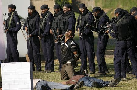 Members of the Force One Commandos from Maharashtra police demonstrate their skills during their inauguration ceremony in Mumbai, , in this November 24, 2009 file photo. REUTERS/Punit Paranjpe/Files