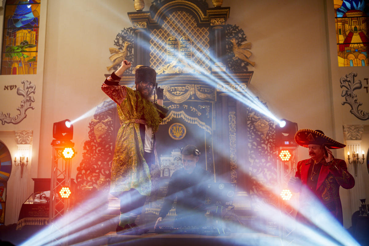 AP PHOTOS: Ukraine celebrates Purim with costumes and dancing, as war drags on