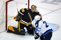 Winnipeg Jets' Blake Wheeler (26) backhands a shot past Pittsburgh Penguins goalie Tristan Jarry for a goal during the first period of an NHL hockey game in Pittsburgh, Sunday, Jan. 23, 2022. (AP Photo/Gene J. Puskar)