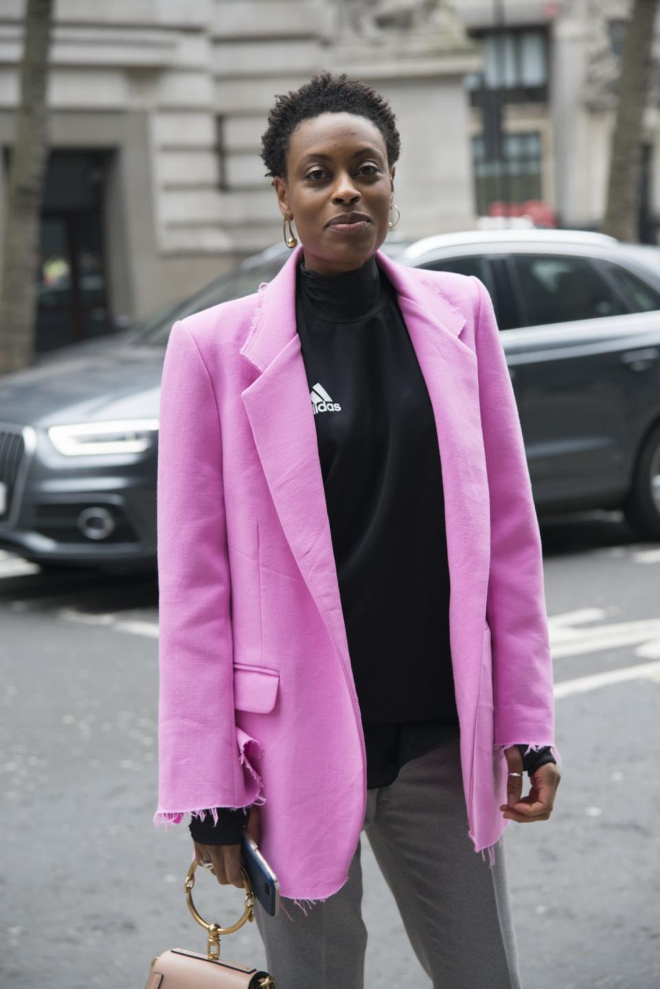 <p>Fashion accessories editor at Elle UK, Donna Wallace, wears a Natasha Zinko jacket, Topman trousers, Chloe bag and Adidas top. [Photo: Kirstin Sinclair/Getty Images] </p>