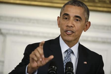 U.S. President Barack Obama gestures while addressing a news conference in the State Dining Room at the White House in Washington, October 2, 2015. REUTERS/Joshua Roberts