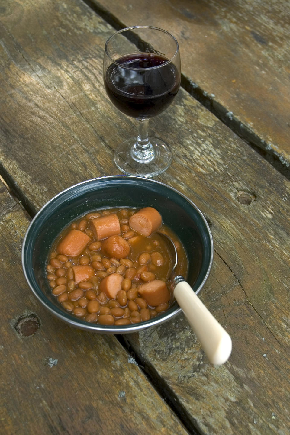 Beanie Weenies with a glass of wine.