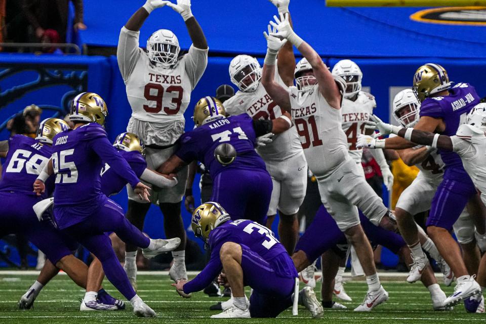 Texas players go high to try to block Washington kicker Grady Gross' field-goal attempt during Monday night's Sugar Bowl. The Longhorns went 12-2 this year and won the Big 12 as they prepare to join the SEC next year.
