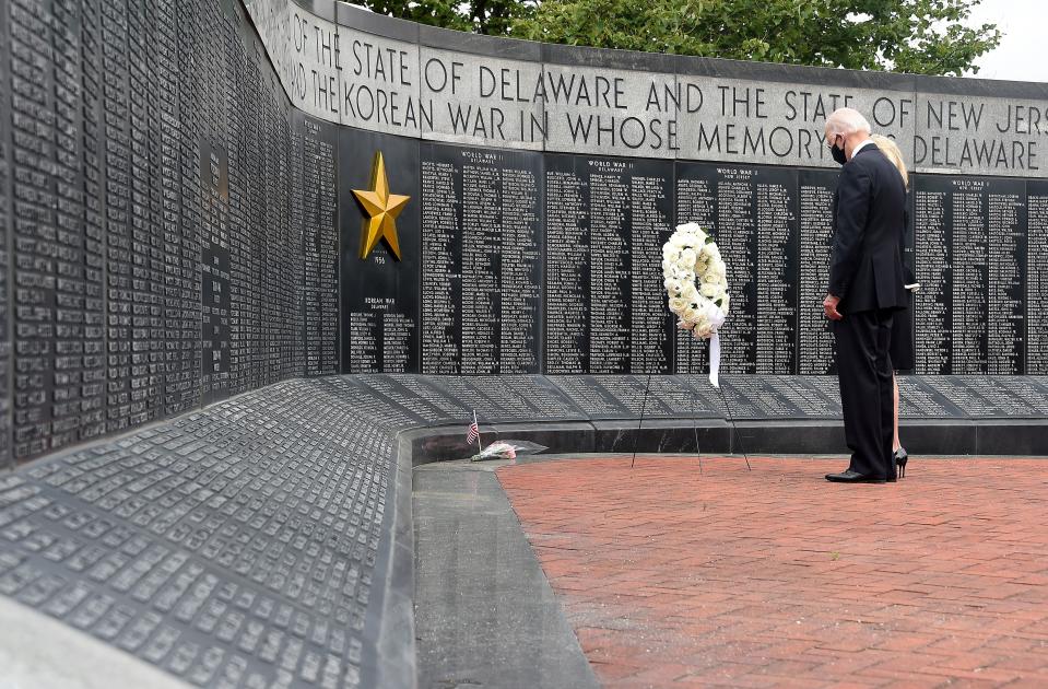 Democratic presidential candidate and former US Vice President Joe Biden and his wife Jill Biden, pay their respects to fallen service members on Memorial Day at Delaware Memorial Bridge Veteran's Memorial Park in Newcastle, Delaware, May 25, 2020. (Photo by Olivier DOULIERY / AFP) (Photo by OLIVIER DOULIERY/AFP via Getty Images)