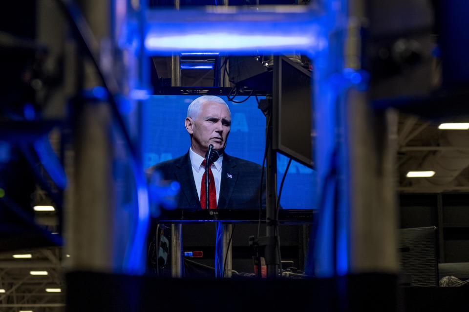 A television screen on the expo floor shows a live feed of Vice President Mike Pence's speech on the first day of the event.